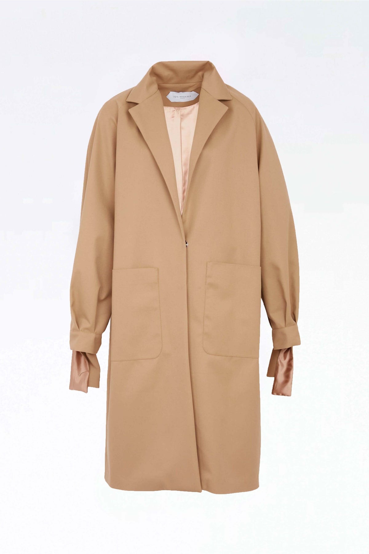 RINGO - Oversized trenchcoat with knotted cuffs in beige gabardine Trenchcoat Fête Impériale